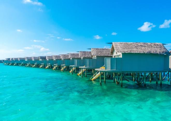 Private overwater villa balcony with ocean view, perfect for a couples island getaway. Private overwater villa balcony with ocean view, perfect for a couples island getaway.