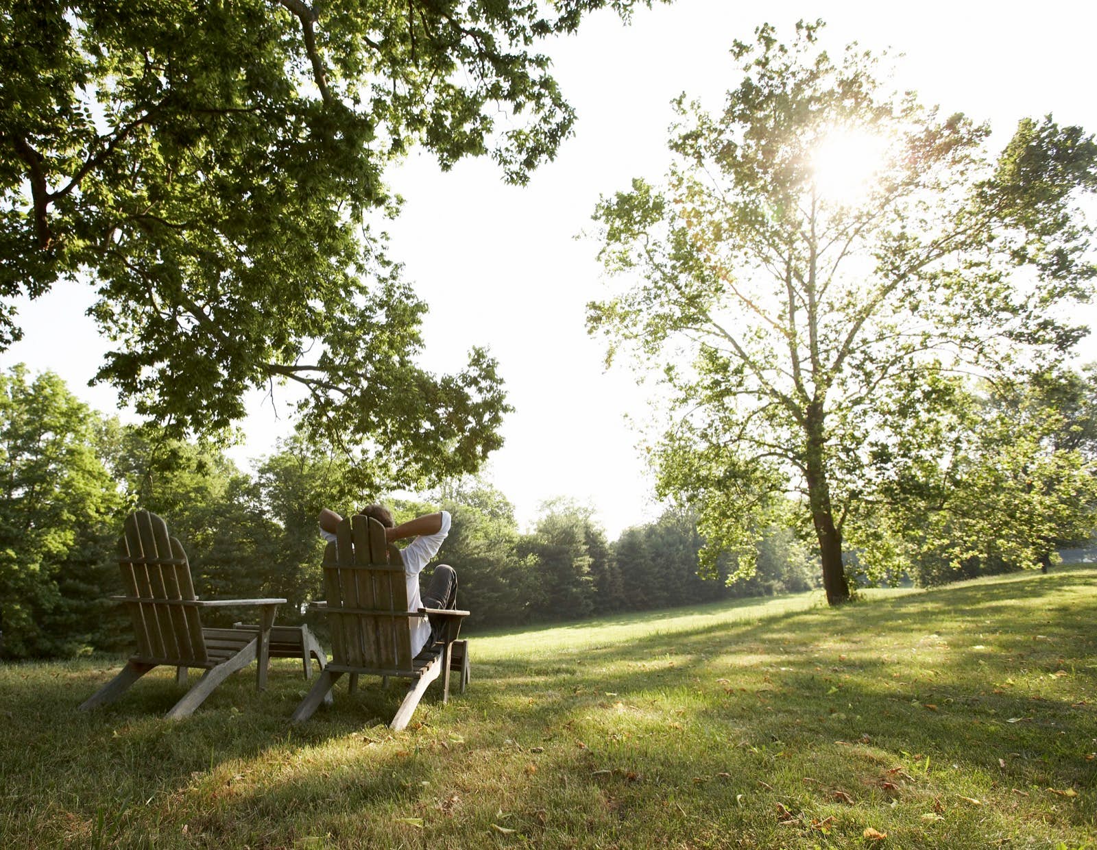New Hope Pennsylvania.jpg A man relaxes in a wooden chair on a grassy lawn